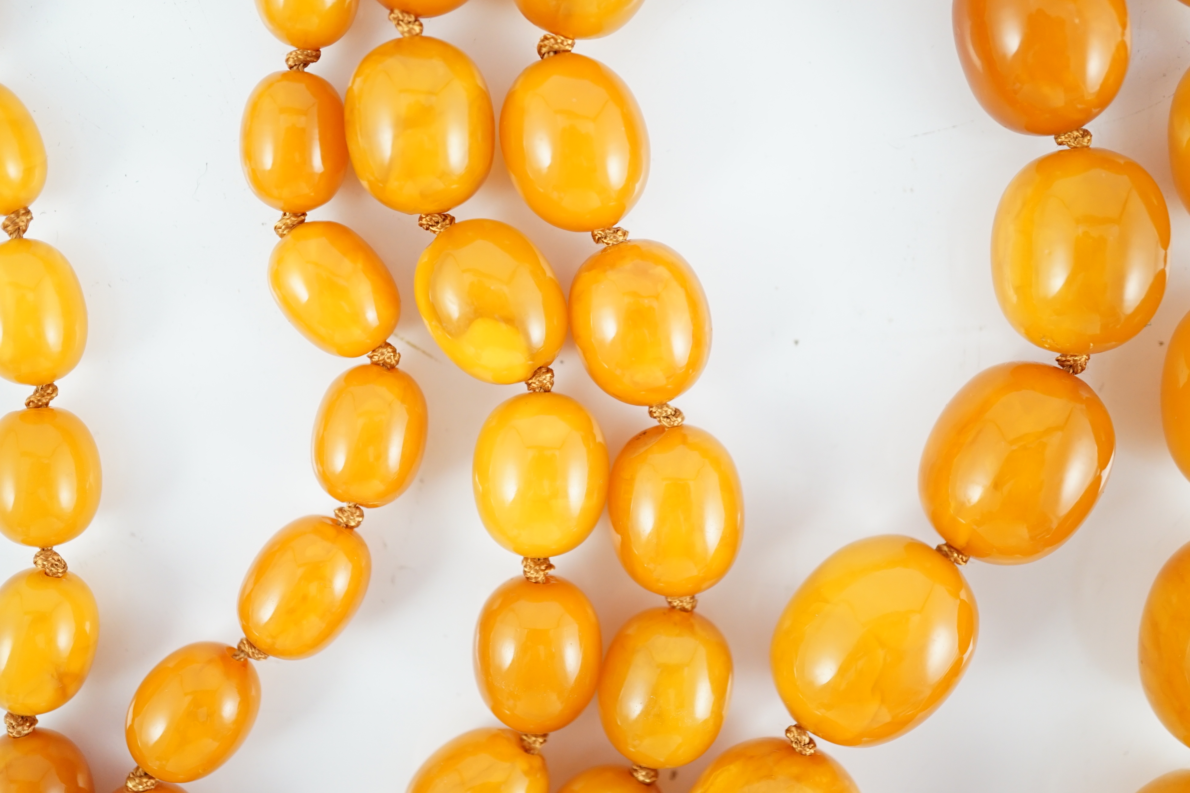 A single strand graduated oval amber bead necklace, 110cm, gross weight 163 grams